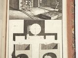 an open book with a drawing of a building and a clock