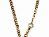 a close up of a necklace with a coin on a chain