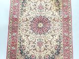 an antique persian rug with a floral design on a white background