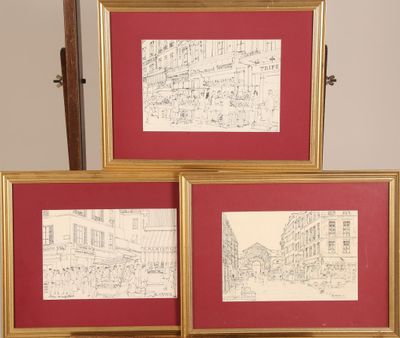 three framed drawings of a street scene in a red frame