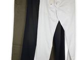 three pairs of men ' s pants hanging on a clothes rack