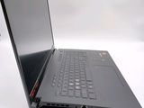 a laptop that is open on a white surface