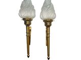 pair of brass and frosted glass sconces on a white background