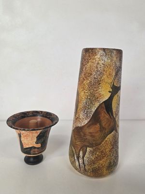 a vase and a vase with a picture of a deer on it
