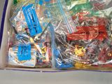 a box full of toys that are sitting on a table