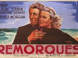une vieille affiche de cinéma représentant un homme et une femme enlacés sur la plage