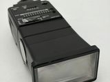 a flash light that is sitting on a white surface