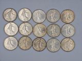 a close up of a bunch of coins sitting on top of a table