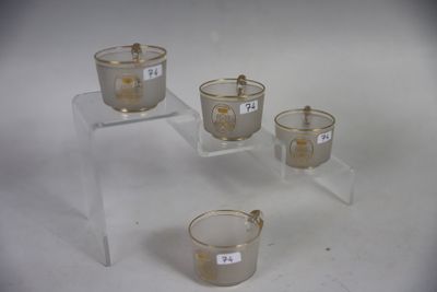three clear cups with numbers on them are sitting on a table