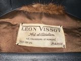 an image of a brown jacket with a label that says leon visssot