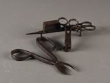 a pair of scissors and a pair of scissors on a table