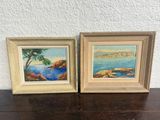 two framed paintings of a beach scene with a tree and a body of water