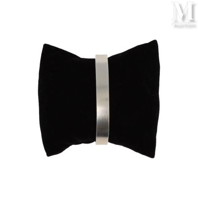 a black bow tie with a silver band on it