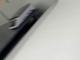 a blurry photo of a person using a cell phone
