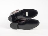 pair of black leather shoes on white background with white background