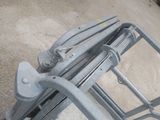 a close up of a metal cart with a handle on it