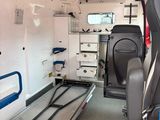 a view of an empty ambulance with the door open