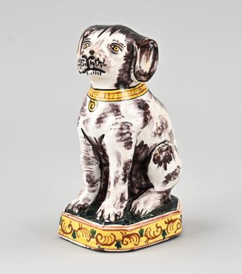 a figurine of a dog with a collar on it ' s neck