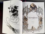 an open book with a drawing of a man and a dog