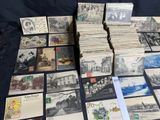 a lot of old postcards on the table