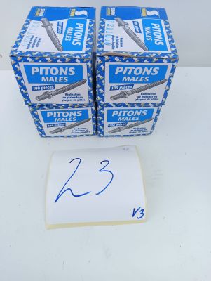 two boxes of razors sitting on top of a table next to a piece of paper