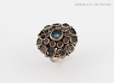 a close up of a ring on a white surface
