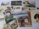 many different pictures of horses and buildings on the table