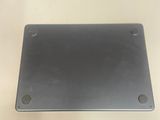 a close up of a metal plate on a white surface
