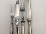 four knives and a fork on a white surface