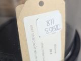 a bird in a glass dome with a tag on it