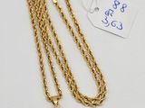 a gold plated necklace with a heart pendant on a chain