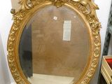 a mirror that is sitting on the floor in a room