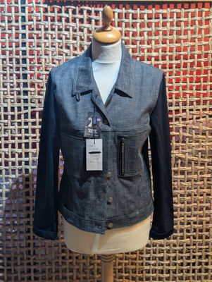 the mannequin is wearing a blue jacket and a black shirt