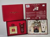 the contents of a red box containing a perfume, body lotion, and a body lotion