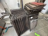 a lot of metal pipes stacked on top of each other