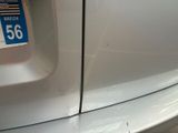 a close up of a car ' s bumper with a sticker on it