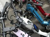 several electric scooters are lined up in a parking lot