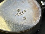a close up of a pan on a black surface