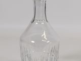 a glass bottle that is sitting on a table