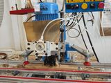 a picture of a machine that is working on a piece of wood