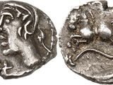 a silver coin with an image of a woman on it