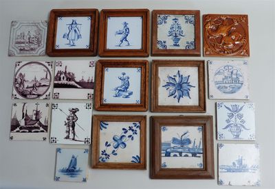 a lot of blue and white tile pictures on the wall