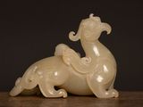 an image of a white sculpture of a horse on a table