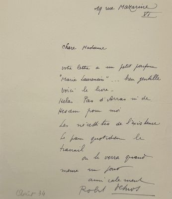 a close up of a handwritten letter on a piece of paper