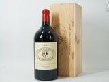 a bottle of wine sitting next to a wooden box