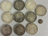 a lot of coins that are sitting on a table