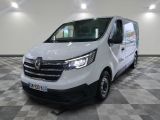 the white van is parked in a large room with checkered flooring