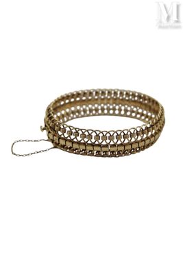 a close up of a bracelet with a chain on a white background