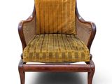 an image of a chair with a yellow cushion on a white background
