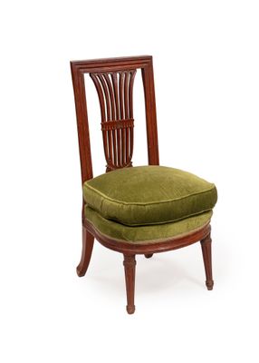 an image of a chair with a green cushion on it